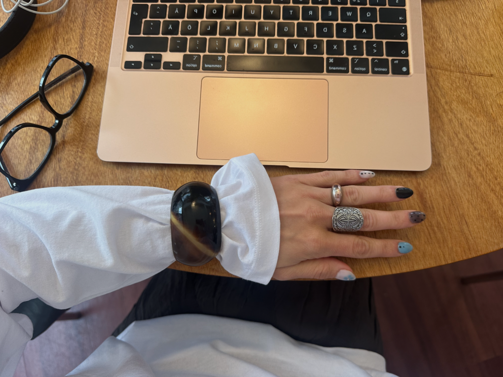 desk with computer and glasses