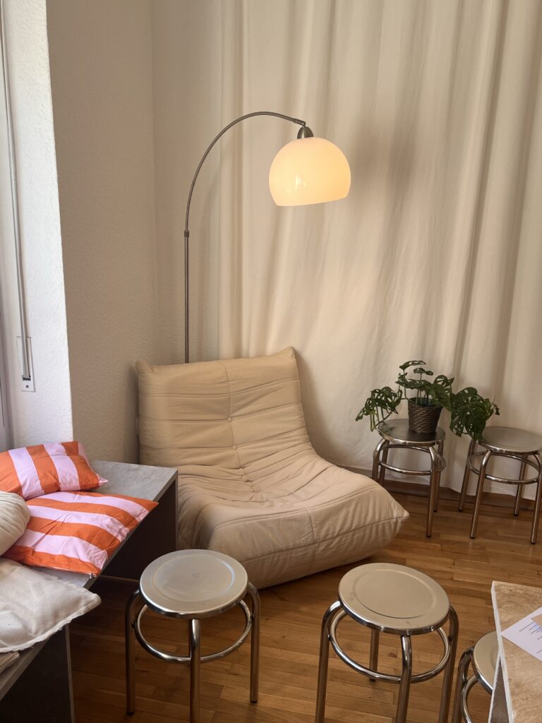 sofa with a lamp, some plants